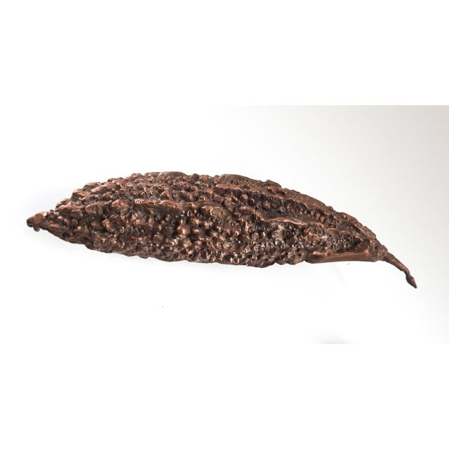 Late 20th century bronze sculpture casting of a bitter melon or balsam pear and three slices. Unsigned, quite heavy, made...