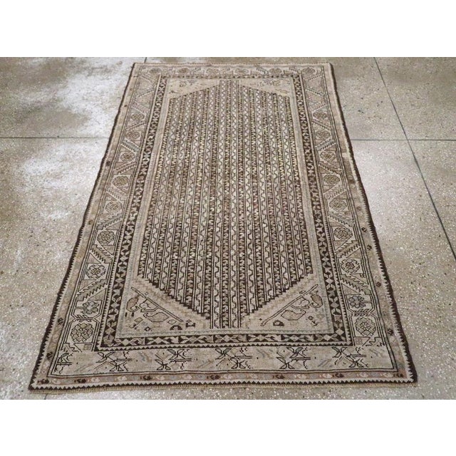 An antique Persian Kurdish accent rug handmade during the Early 20th century. Measures: 4' 0" x 6' 1"