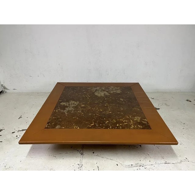 Large living room table with leather base and plastic top similar to the Italian 60s manufacturing resin. The table has...