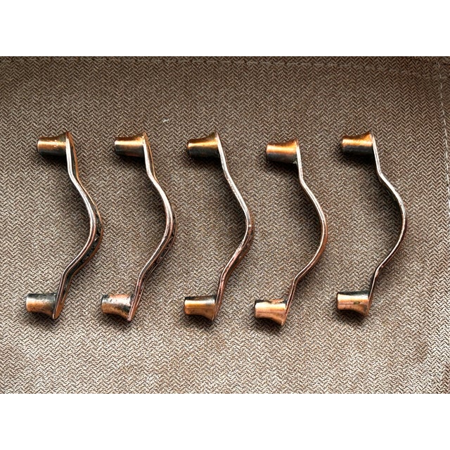 Set of 5 copper drawer pulls. Mounting screws included.
