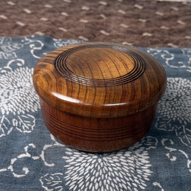 This Japanese wooden lidded container is a traditional chazutsu, made to store loose tea neatly and protected from light...