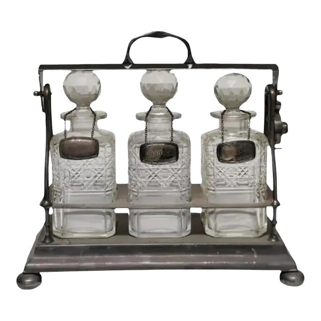 Early 20th Century English Silver Plate Three Bottle Tantalus Set- 4 Pieces For Sale