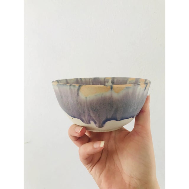 Three nesting bowls all signed by Marian Dalton. The glaze is a lovely drippy lilac.