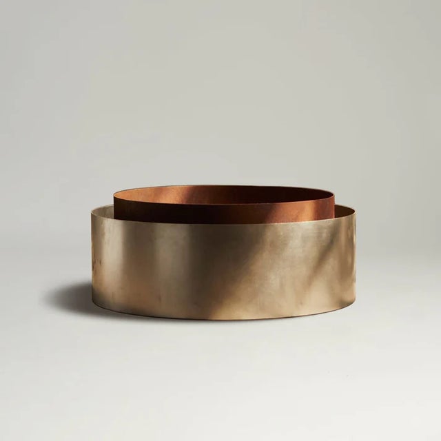 A dyad of mixed metals. The Concentric Fire Pit is composed of a weathered steel ring nested within a stainless steel...