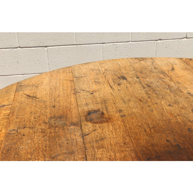 A beautiful Country French drop-leaf dining table crafted from solid tiger oak, featuring a classic gateleg design that...