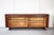 A beautiful Model 41 teak sideboard with tambour doors, designed by Grete Jalk for Sibast, Denmark. This sideboard...