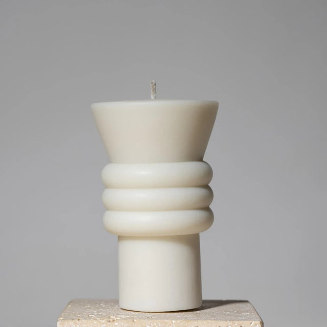 Hand-poured sculptural pillar candle inspired by postmodern design, made with 100% USA beeswax and a cotton wick. This...