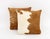 Pair of Modern Cowhide Throw Pillows, each with zipper closure. 18.5" L x 18.5" W x 6.5" D. Provenance: From a SoHo, New...