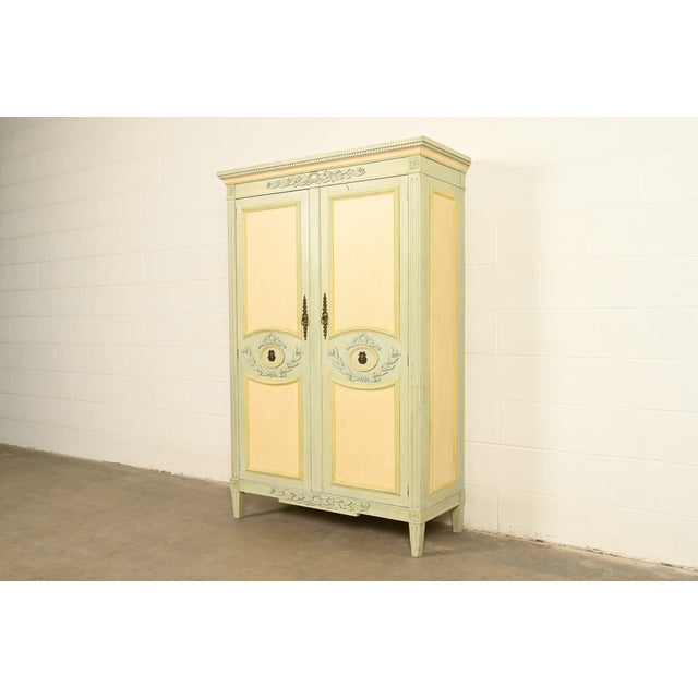 A gorgeous French Provincial or French Regency Louis XVI style armoire dresser or linen press By Baker Furniture USA,...