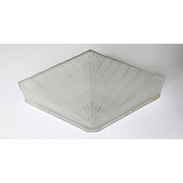 A single French Art Deco frameless wall sconce by French Artist “Degue” in great condition. The shade is in clear and...