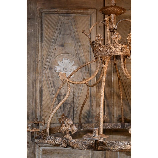 Exceptional large crowned wrought iron chandelier with 8 lights. 17th century. Provenance and history known, which will be...