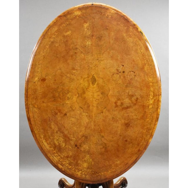 Victorian Burr Walnut Inlaid Loo Table Item Code: LC1458 A handsome Victorian burr walnut loo table of generous...