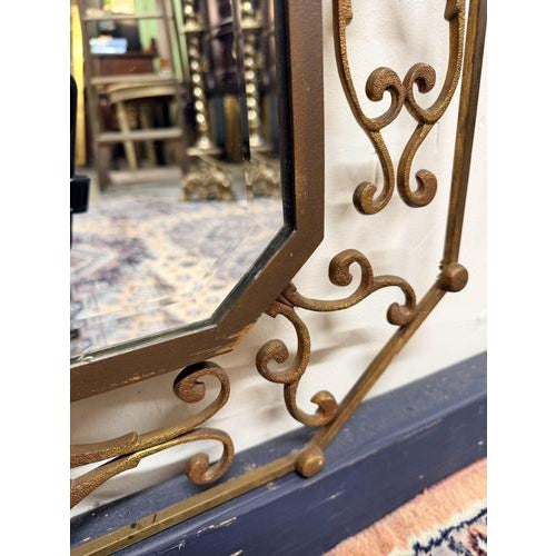 Mid-century Italian brass mirror signed Moderna, featuring an elegant octagonal frame and original beveled glass. This...