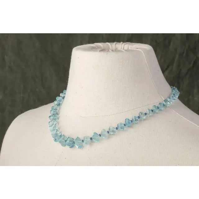 Cushion cut, faceted natural aquamarines with faceted sapphires between by Deborah Lockhart Phillips. Lovely cut and...