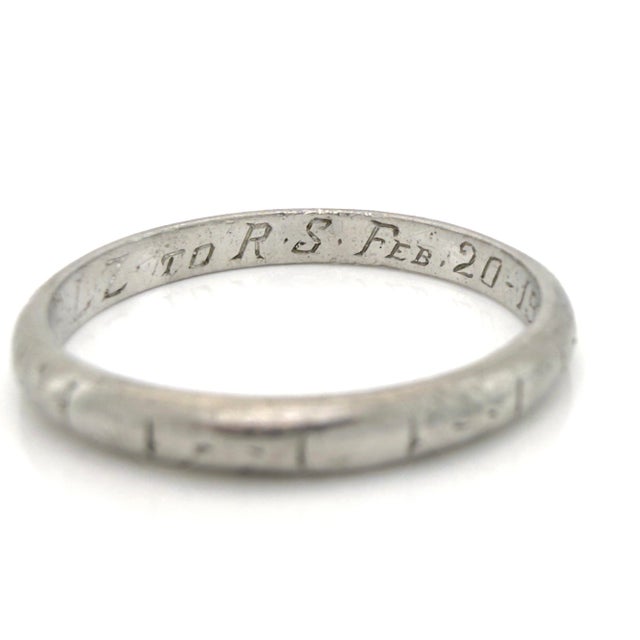 About This Ring: A timeless Art Deco wedding band carrying a beautiful love story. The inscription reads "P.L.Z To R.S....