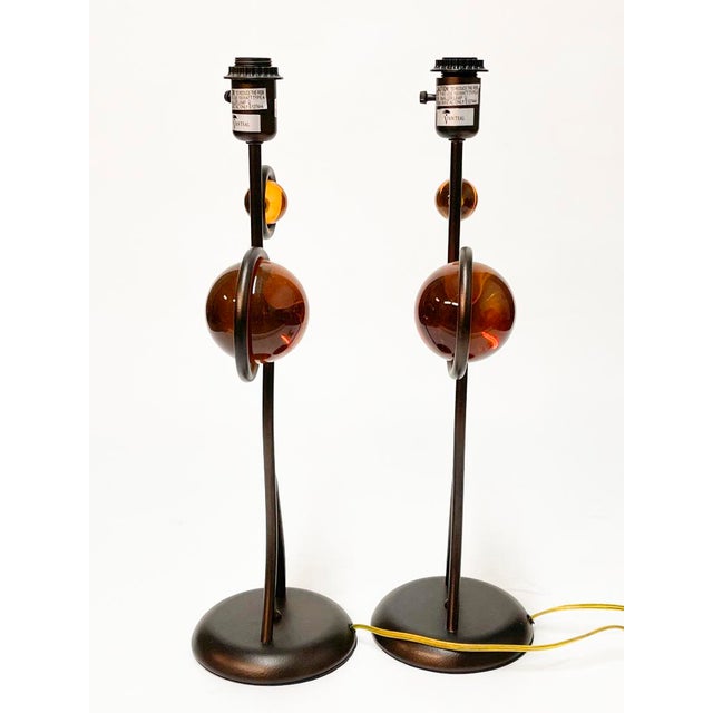 A stunning pair of Van Teal lamps with a bronze finish and lucite spheres very reminiscence of the 70s these comes with no...