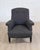 Elegant French armchair dating to the early 20th century, circa 1910. This handsome chair features a generously...
