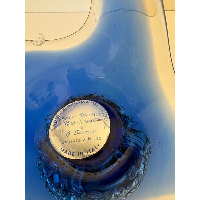 This piece has a tag in the center that says Made in Italy and also I found a translation that said Centuries of Glass...