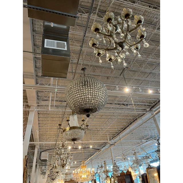 The Jumbo Spherical Crystal Chandelier with Acanthus Top is a breathtaking statement piece that combines grandeur with...