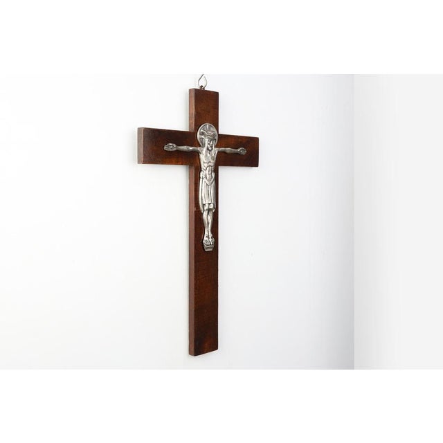 A striking and expressive Art Deco crucifix from Belgium, dating to the 1920s. This large wall‑mounted piece combines the...