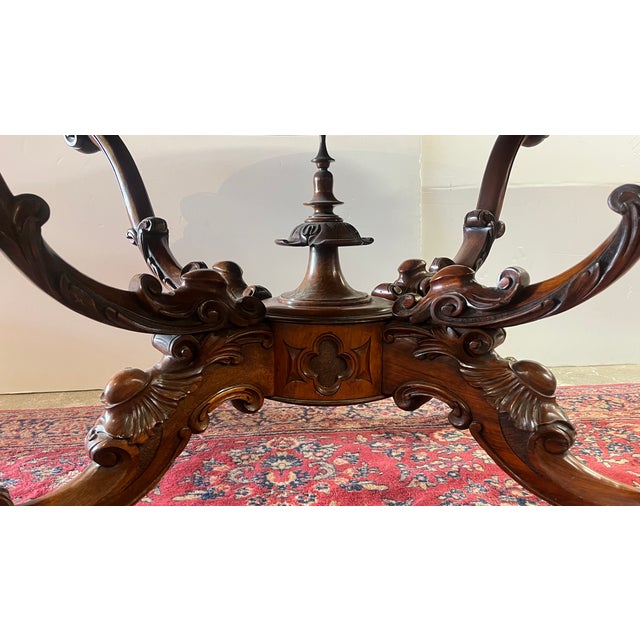 Victorian antique burled walnut center table, dating from the mid-19th century. This beautiful table features a...