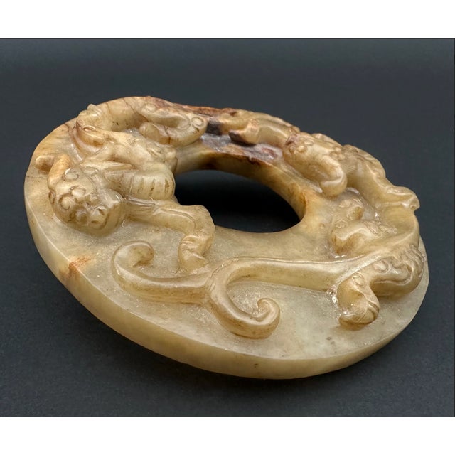 Bi Disks are Chinese artifacts of various meaning, often marked with symbols of heaven and earth, and often used in the...