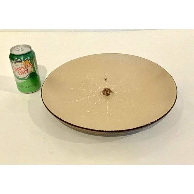 1990s French Plate with Spider catching an insect on a spiderweb. Brown, black, white, and sand colors. Textured details....