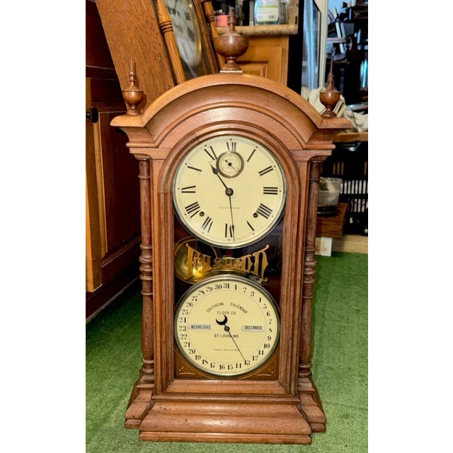 This listing is for an antique double dial calendar clock. This clock was manufactured as a collaborative piece between...