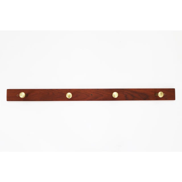 Danish Teak & Brass Coat Rack, Denmark, 1960s, in Very Good conditions. Designed 1960 to 1969