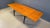 Elegant italian mid century dining table. The dining table has two extractable table tops and a black ebonized wooden base...
