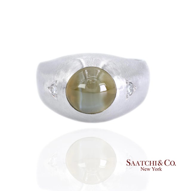 Cat's Eye and Natural Diamond Ring Metal Type: Platinum Total Item Weight: 22.2 Grams Ring Size: 9.75 (Resizable) 1:...