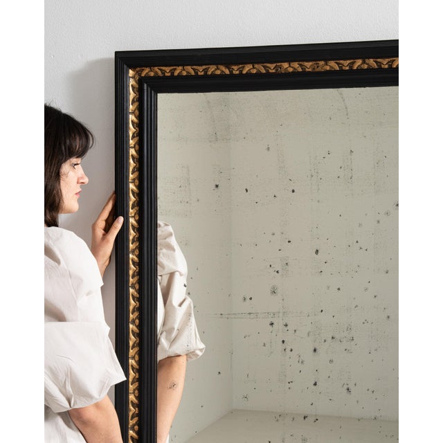 A mirror whose dark wood frame with gilt inner banding, large gives it real character at first glance. Dating to 1900s and...