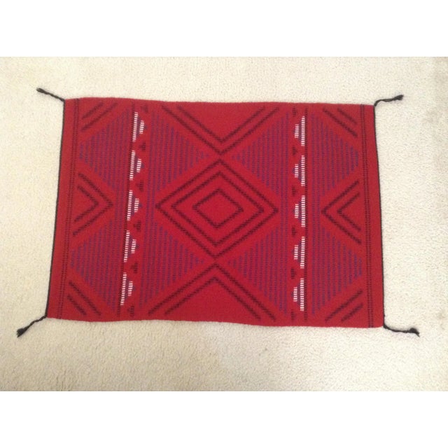 This small red Navajo piece is a Third Phase Chiefs Blanket pattern. The weaver, Bernadine Tsosie, has created a modern...