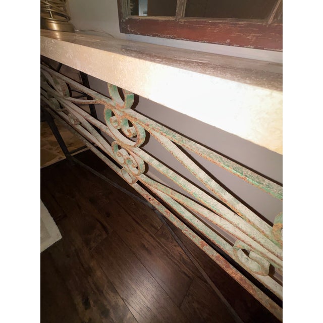 This is a custom made table put of historical wrought iron. The limestone is a custom ordered top. You will not find this...