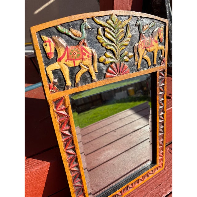 This hand-painted wooden mirror is an Indian Jharokha mirror, a traditional decorative style inspired by the ornate...