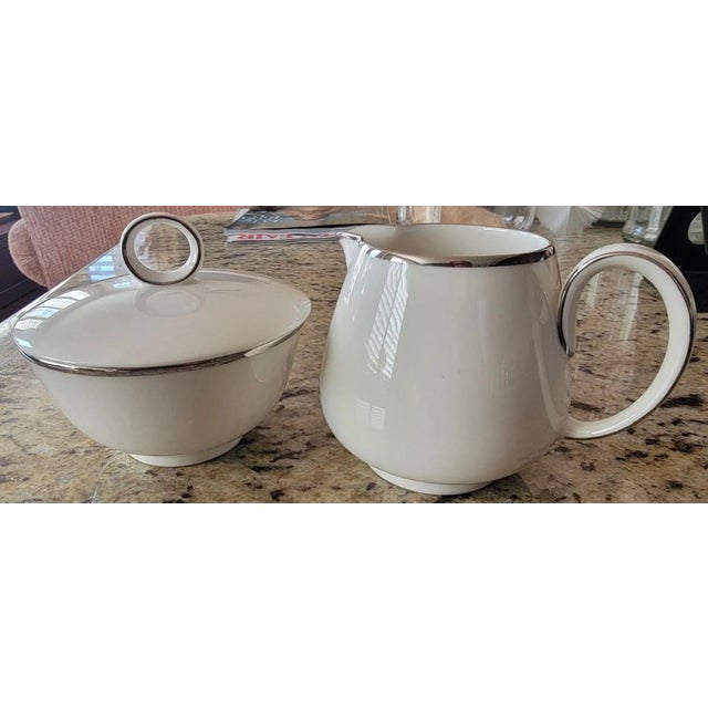 Perfect condition porcelain sugar bowl with lid and creamer. No chips, cracks or crazing. Mid-century Simplicity pattern...