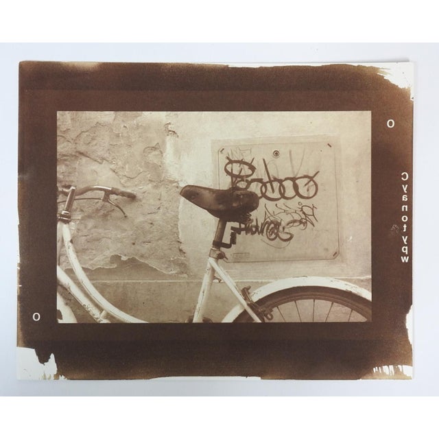 Vintage late 20th century sepia tone cyanotype photograph on heavy paper by Eric C. Weller (20th century) Texas. Bicycle...