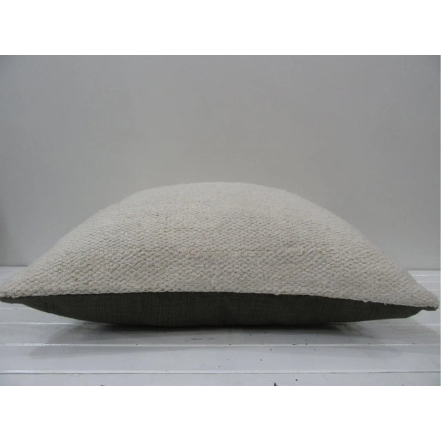 This is a pillow cover made from a vintage kilim rug. The piece was properly washed and ready to use. Pillow inserts not...