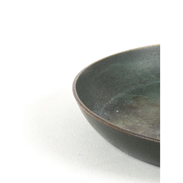 A sculptural Scandinavian Art Deco bronze vide-poche or catchall dish from the 1930s, featuring a seated female nude...