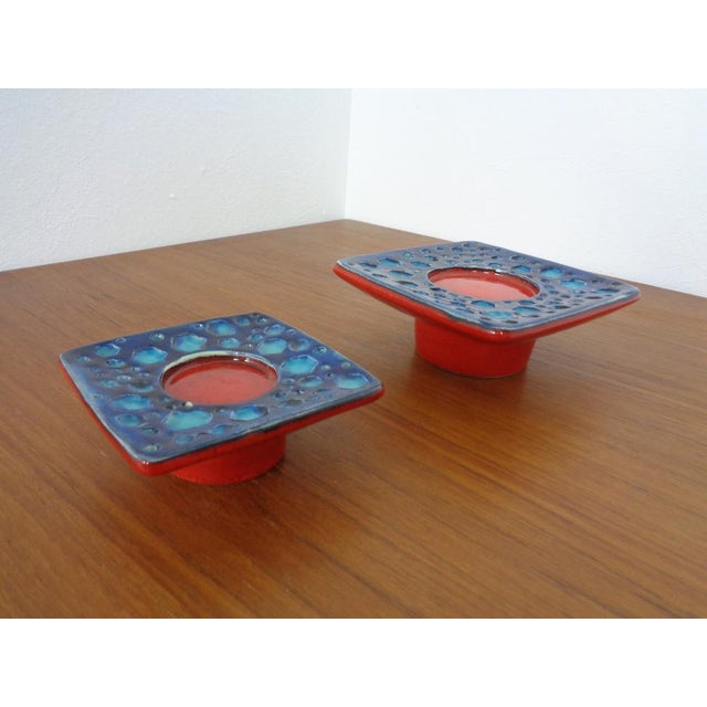 Two ceramic candlesticks from Dümler & Breiden. Described on the subpage. Height 5/6 cm. Width 12/16 cm. Depth 12/16 cm....