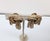 1950s goldtone two lines of chains in a knot shape with fringe dangles clip earrings. Marked "NAPIER PAT. PEND." Measure:...