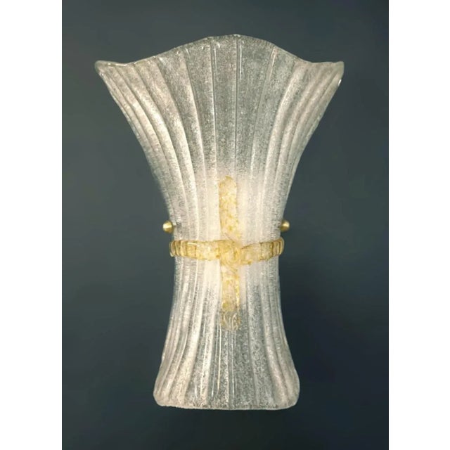 Vintage Italian wall light with a clear Murano glass shade hand blown with granular texture using Graniglia technique with...