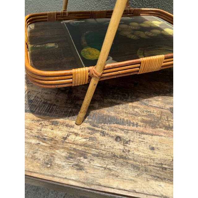 This charming two-tiered tray stand is a quintessentially bohemian piece, combining the natural allure of woven rattan...