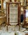 Showcase your most treasured collectibles in this magnificent French Louis XV Curio Display Cabinet, a luxurious statement...