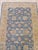 This blue wool runner rug features a classic Rabat style design with a hand knotted pile weave. The primary blue color...