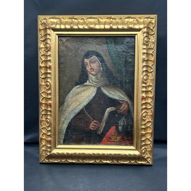 An intimate oil-on-canvas portrait of Saint Teresa of Ávila, attributed to the Spanish Colonial School, though a Spanish...