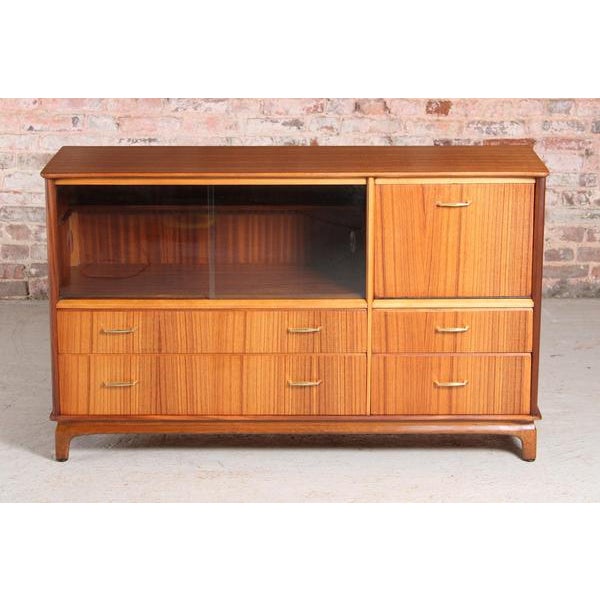 Mid Century tola sideboard / drinks cabinet by Harris Lebus, circa 1960s. Excellent restored condition. W 132cm D 45cm H 80cm