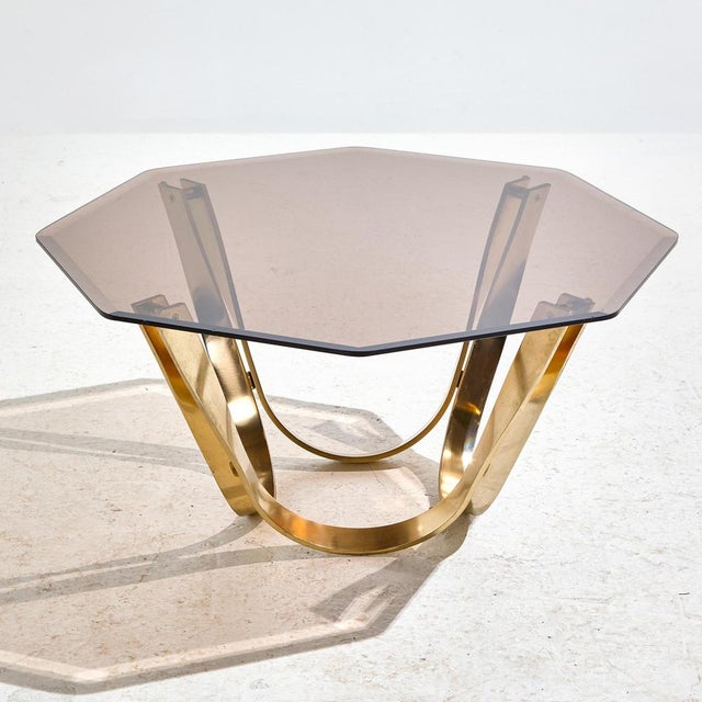 Solid brass coffee table with octagon smoked glass top from the 1970s designed by Roger Sprunger for Dunbar. with some...
