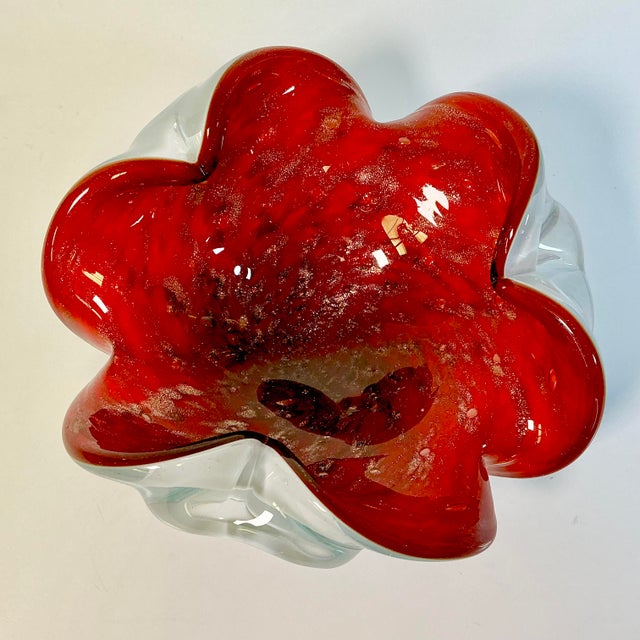 In a word…stunning. This Murano blown glass decorative bowl is dramatic in its Ruby Red against White and transparent...