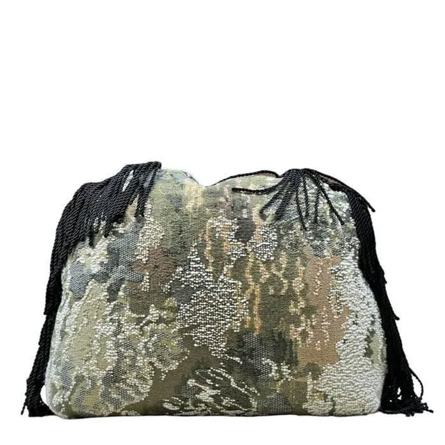 A truly unique pillow with an unusual shape and highly expressive fabric. A rich jacquard cloth by Metaphores woven on...